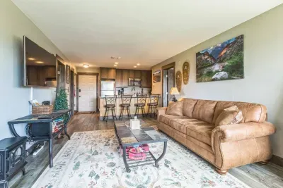 Your cozy mountain basecamp.
Whether you're cuddled up for movie night on the oversized leather couch or setting up a family game marathon at the coffee table, this living space is ready for connection.