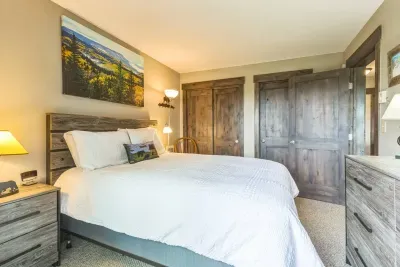 Laid-back mountain charm meets a plush, pillow-topped queen bed.
Unpack, unwind, and make yourself at home—there’s plenty of closet space and even more cozy vibes.

P.S. That view from the balcony? Yep, it’s all yours.
