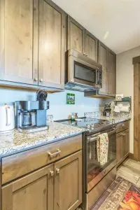 Cook up comfort food or après-ski snacks in this fully stocked kitchen. From the smooth electric cooktop to the spice rack and Keurig duo, we’ve got your cravings covered.