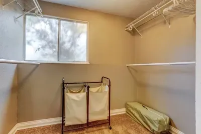 Pack your bags—we’ve got plenty of space! 🧳 This walk-in closet even includes a Pack-&-Play, so little travelers sleep as soundly as you do. 👶✨