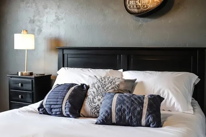 Cozy up in style! 🌙 This bed is all about plush pillows, modern comfort, and a touch of rustic charm. Updated with clean white linens. Sweet dreams guaranteed! #RelaxAndUnwind
