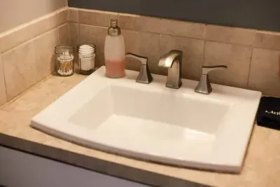 Freshen up in style! Our sparkling sink is stocked with essentials like cotton swabs and soap, making your stay as convenient as it is comfortable. 🧴✨