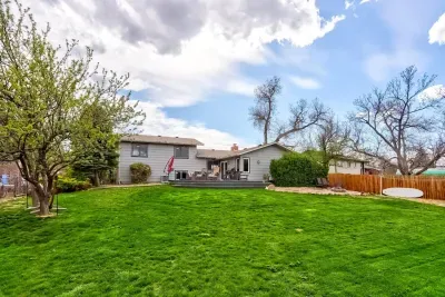 Enjoy a large, fully fenced backyard with a huge deck perfect for grilling or cozy nights by the firepit. Plus, with a doggy door for easy access, your pups can come and go as they please, making this the ideal retreat for everyone in the family!