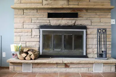 Wood burning fireplace to cozy up by, with a good book or movie in the living room with your furry friends.