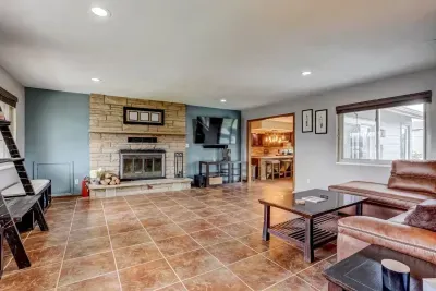 Smart TV for streaming, no cable or satellite. Games and kids toys are available in the basket of the TV stand. Multiple throw blankets. Wood burning fireplace to cozy up by, with a good book or movie in the living room.