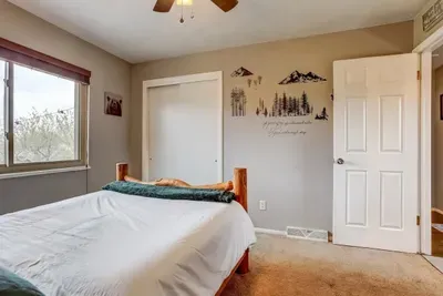 Wake up to mountain vibes and a bear-y cute view! 🐻 Cozy bedding and serene decor make this the perfect retreat for adventurers. #CabinComforts