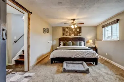 Rest easy in our cozy bedroom with a plush king bed—and don't worry, we didn’t forget your furry friend’s VIP sleeping spot! 🐾🛏️✨