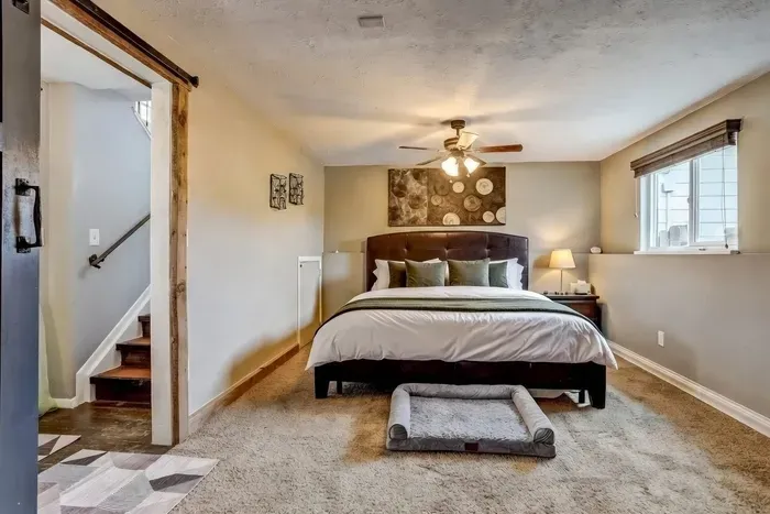 Rest easy in our cozy bedroom with a plush king bed—and don't worry, we didn’t forget your furry friend’s VIP sleeping spot! 🐾🛏️✨