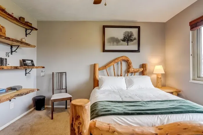 Drift off in rustic luxury 🌲 This handcrafted log bed and serene decor promise sweet dreams in white 100% cotton bedding in a nature-inspired retreat. #CozyVibes #MountainEscape