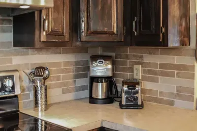 Start your mornings right! ☕️ Fresh coffee and crispy toast are just a click away in our cozy kitchen corner. #CoffeeFirst #StayComfortable