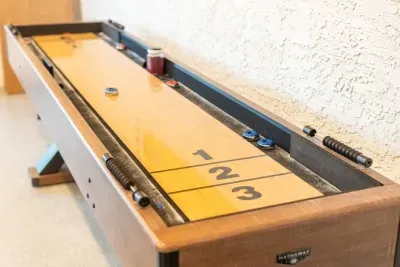 Shuffle board in game room