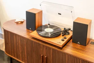 Turntable with curated collection of vinyls