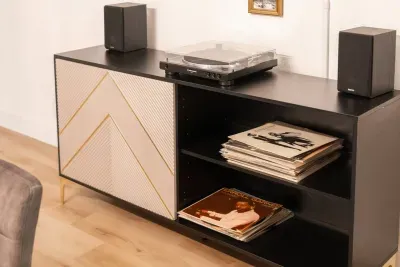 Relive classic tunes with our record player and curated selection of vinyl records.