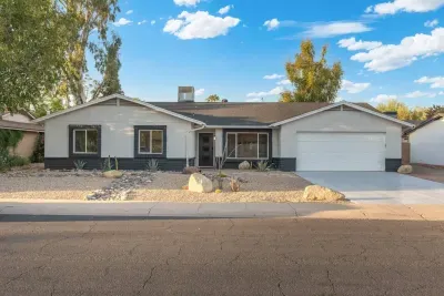 Exterior View: Modern Arizona retreat with vibrant landscaping and great curb appeal!