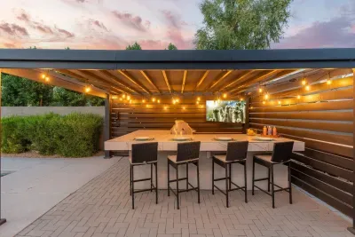 Cook and dine al fresco in the fully stocked outdoor kitchen and bar area
