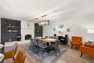 Unwind in our serene dining room, featuring a cozy fireplace and a peaceful reading nook.