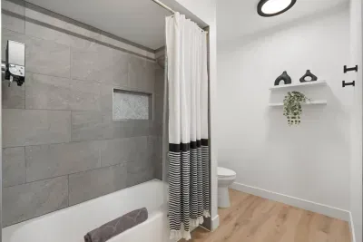 Tub/shower combo with shampoo, conditioner and body wash provided.
