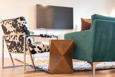 Sleek, modern furnishings and warm, rustic accents blend seamlessly in this elevated lounge space.