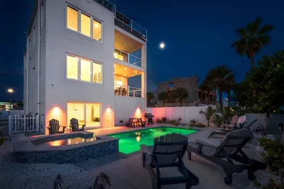This stunning property glows at night, with outdoor spaces perfect for entertaining, relaxing, and creating unforgettable memories.