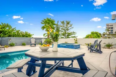 Enjoy meals or drinks at the poolside dining table while basking in the sunshine and sea air.