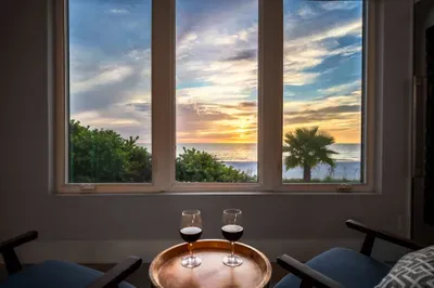 Unwind with a glass of wine while the sun paints the sky over the Gulf. This cozy seating nook is the perfect place to relax and take in the breathtaking views.