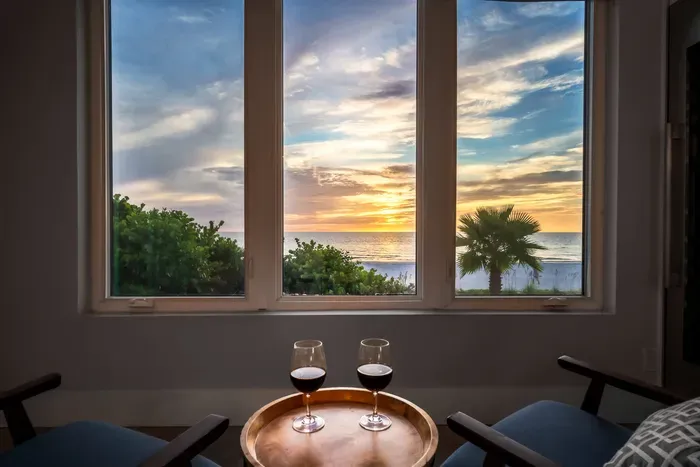 Unwind with a glass of wine while the sun paints the sky over the Gulf. This cozy seating nook is the perfect place to relax and take in the breathtaking views.