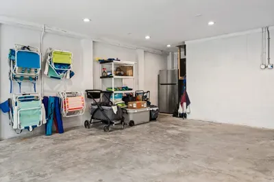 Spacious garage stocked with beach essentials — chairs, umbrellas, and more — so you’re fully equipped for fun in the sun.