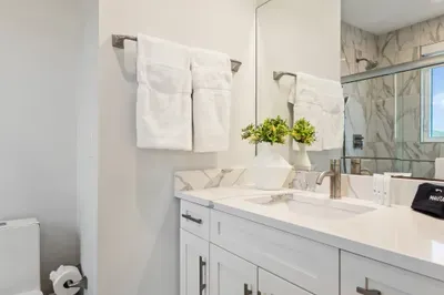 Another thoughtfully designed bathroom with a modern shower and vanity, offering both style and convenience.

Bathroom 3