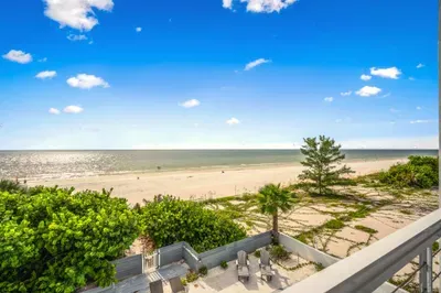 Take in sweeping ocean views from your private balcony overlooking sandy shores and swaying palms. Start your day with sunrise coffee or unwind at sunset while enjoying the peaceful beauty of this stunning beachfront setting!