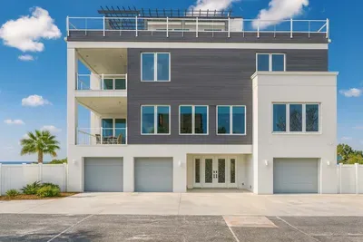 Welcome to your modern beachfront escape featuring sleek architecture, spacious balconies, and ample parking. Designed for comfort and style, this stunning coastal home offers the perfect base for an unforgettable seaside getaway!