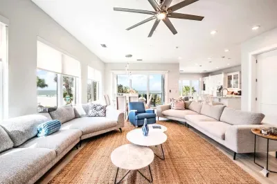 Gather in this expansive, sun-filled living room with plush sectional seating, stylish décor, and coastal views throughout. Perfect for entertaining or relaxing, this inviting space blends comfort and elegance for the ultimate beach getaway!