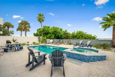 Relax by the pool and spa with ocean views just beyond. The perfect spot for sunbathing, swimming, and soaking in paradise.