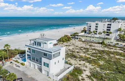 Experience coastal living in this stunning beachside retreat just steps from the sand. Enjoy panoramic ocean views, modern design, and a prime location near dining and развлечments—perfect for a relaxing and unforgettable seaside getaway!
