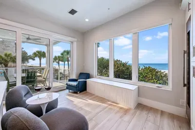 Unwind in this sunlit coastal nook with panoramic ocean views, cozy seating, and serene natural light. Perfect for morning coffee or evening wine, this inviting space offers a peaceful retreat to relax and soak in the beauty of the sea!
