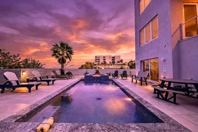 End your day by the glowing pool under breathtaking sunset skies. Lounge poolside, soak in the tranquil ambiance, and enjoy the perfect blend of luxury and coastal beauty in this stunning evening retreat!