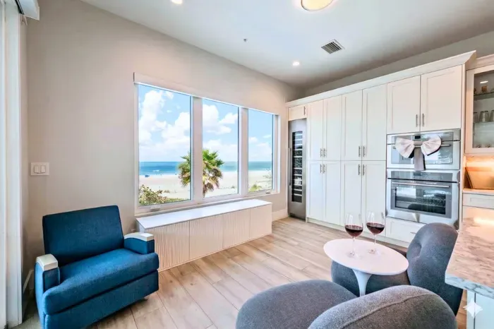 Enjoy a cozy coastal retreat with stunning ocean views, plush seating, and abundant natural light. Sip wine by the window, relax in comfort, and take in the serene beachfront scenery from this inviting and stylish space!