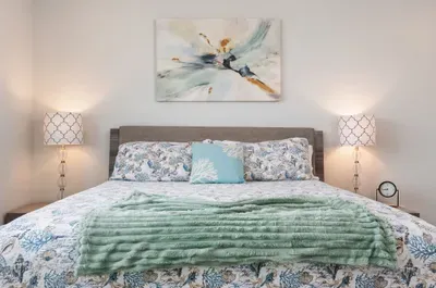 A cozy retreat with a plush queen bed, soft linens, and soothing décor — perfect for restful nights after a day of fun in the sun.