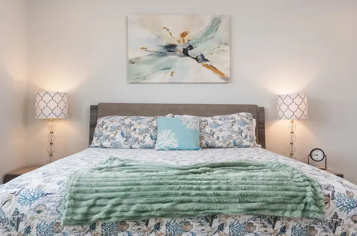 A cozy retreat with a plush queen bed, soft linens, and soothing décor — perfect for restful nights after a day of fun in the sun.