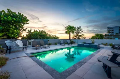 The pool lights up beautifully in the evening, creating a magical setting for night swims or cocktails under the stars.