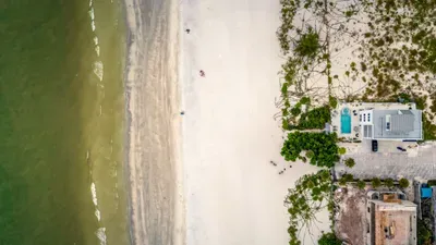 Steps from pristine sands, this beachfront retreat offers unbeatable access to the shore and sweeping coastal views. Wake up to the sound of waves, stroll the beach anytime, and enjoy the ultimate seaside escape right outside your door!