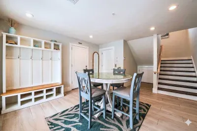 Gather in this welcoming dining space with a stylish table, ample seating, and a convenient entry nook for beach gear. Bright, open, and functional, it’s perfect for meals, games, and planning your next coastal adventure!