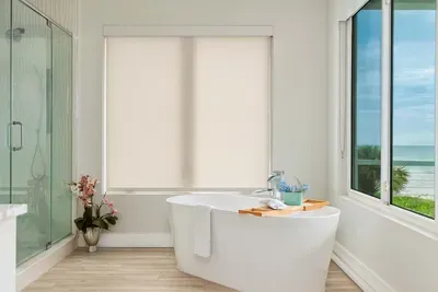 Unwind in the luxurious soaking tub surrounded by wide windows. The perfect place to relax while soaking in the views of the Gulf.