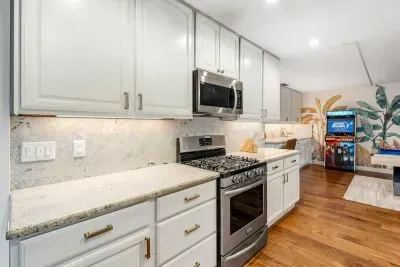 Kitchen opening to game room.