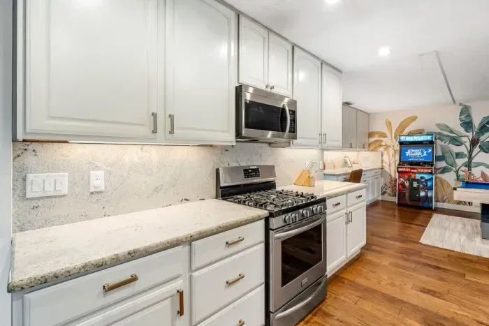Kitchen opening to game room.