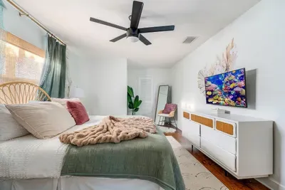 Primary bedroom with smart TV.