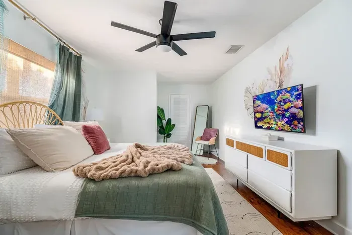 Primary bedroom with smart TV.