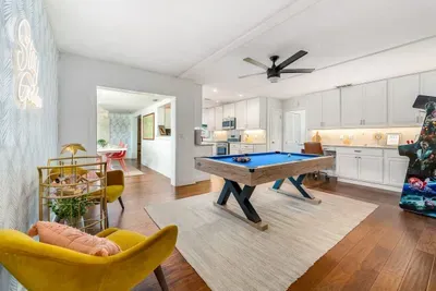 Game room opening to dining room and kitchen.