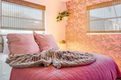 Queen bedroom with flamingo theme.