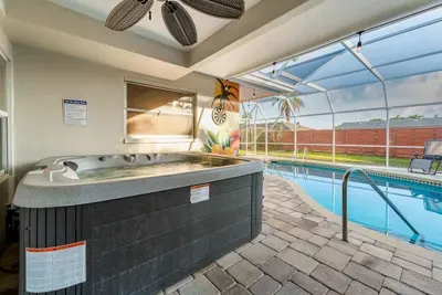 Hot tub overlooking pool.