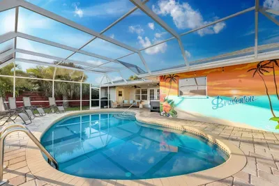 Pool area, Bradenton mural, and patio furniture.